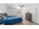 Simple bedroom with a bed, large closet, and a dresser at 6121 Fjord Way, New Port Richey, FL 34652