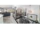 Bright foyer featuring decorative railings and pillars that overlook an open-concept living area with water views at 6121 Fjord Way, New Port Richey, FL 34652