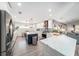 Spacious kitchen boasts a center island, stainless steel appliances, and ample countertop space at 6121 Fjord Way, New Port Richey, FL 34652
