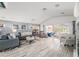 Bright and airy living room featuring modern décor, tile floors, and plenty of seating at 6121 Fjord Way, New Port Richey, FL 34652