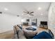 Bright living room with a ceiling fan, recessed lighting, a sliding glass door, and a stone fireplace at 6121 Fjord Way, New Port Richey, FL 34652