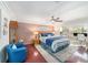 Cozy main bedroom with a king-size bed, hardwood floors, and a waterfront view at 6121 Fjord Way, New Port Richey, FL 34652