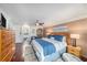 Comfortable main bedroom with a king bed, modern decor, and a view to the ensuite bathroom at 6121 Fjord Way, New Port Richey, FL 34652
