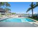 Beautiful backyard featuring a sparkling swimming pool, patio, and waterfront views at 6121 Fjord Way, New Port Richey, FL 34652