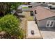Aerial view of backyard with tiled patio, shed and privacy fence at 6812 Fountain Ave, Tampa, FL 33634