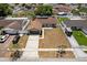 Aerial view of a single-Gathering home featuring a long driveway and fenced yard in a residential neighborhood at 6812 Fountain Ave, Tampa, FL 33634