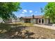 Backyard with a tiled patio, privacy fence and storage shed at 6812 Fountain Ave, Tampa, FL 33634