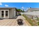 Backyard with a tiled patio, modern home and privacy fence at 6812 Fountain Ave, Tampa, FL 33634