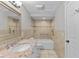 Bright bathroom featuring a granite vanity, shower-tub combo, and tile walls at 6812 Fountain Ave, Tampa, FL 33634