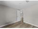 Neutral bedroom featuring modern wood-look floors and closet at 6812 Fountain Ave, Tampa, FL 33634