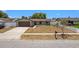 Well-kept single-story home featuring an attached garage and mature landscaping at 6812 Fountain Ave, Tampa, FL 33634