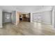 Spacious open-concept living area with modern flooring and ample natural light at 6812 Fountain Ave, Tampa, FL 33634