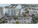Aerial view of the condo building with tennis courts and convenient parking at 7150 Sunset Way # 405, St Pete Beach, FL 33706
