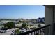 Balcony view overlooking the neighborhood, offering a glimpse of local attractions and amenities at 7150 Sunset Way # 405, St Pete Beach, FL 33706