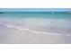Calm beach featuring clear water and soft sand, ideal for a peaceful day by the ocean at 7150 Sunset Way # 405, St Pete Beach, FL 33706