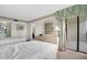 Bright bedroom with direct access to the balcony offers a peaceful retreat at 7150 Sunset Way # 405, St Pete Beach, FL 33706