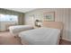 This well-lit bedroom creates a calming space for rest and rejuvenation at 7150 Sunset Way # 405, St Pete Beach, FL 33706