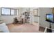 Bright bedroom with a desk, shelving and large window offering plenty of natural light at 7150 Sunset Way # 405, St Pete Beach, FL 33706