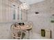 Eat in kitchen featuring a mosaic table, chandelier, and window with natural light at 7150 Sunset Way # 405, St Pete Beach, FL 33706