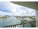 Expansive water view from the condo's balcony with blue skies and cumulus clouds overhead at 7150 Sunset Way # 405, St Pete Beach, FL 33706