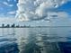 Stunning waterfront view of the city skyline reflecting in the calm, serene water at 7150 Sunset Way # 405, St Pete Beach, FL 33706