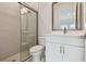 Elegant bathroom with a walk-in shower, vanity, and neutral color palette at 7232 Sutton Ln, Sarasota, FL 34240