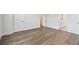 Bedroom with light-colored floors, and a glimpse of the vanity through an open door at 7232 Sutton Ln, Sarasota, FL 34240