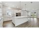 Spacious, all-white kitchen with a large center island and stainless steel appliances at 7232 Sutton Ln, Sarasota, FL 34240