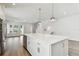 Open-concept kitchen featuring a large island, stainless steel appliances, and seamless flow to living spaces at 7232 Sutton Ln, Sarasota, FL 34240