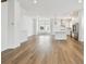 Bright living room with modern kitchen featuring stainless steel appliances and an island at 7232 Sutton Ln, Sarasota, FL 34240