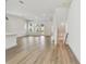 Open-concept living room featuring wood floors, neutral paint, recessed lighting, and a staircase at 7232 Sutton Ln, Sarasota, FL 34240