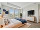 Spacious main bedroom featuring a large bed, modern dresser, and bright windows at 7232 Sutton Ln, Sarasota, FL 34240