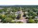 An aerial view of the home with the downtown skyline of the city in the background and nestled in a green neighborhood at 785 52Nd N Ave, St Petersburg, FL 33703