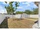 Fenced backyard with a well-kept lawn and landscaping, offering privacy and space at 785 52Nd N Ave, St Petersburg, FL 33703