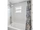 Bathroom tub and shower featuring blue patterned shower curtain at 785 52Nd N Ave, St Petersburg, FL 33703