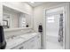Bathroom featuring double sinks with marble countertops and a separate shower/tub area at 785 52Nd N Ave, St Petersburg, FL 33703