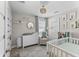 Charming Bedroom with neutral colors, a crib, dresser, and playful animal decor at 785 52Nd N Ave, St Petersburg, FL 33703