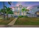 Charming two-story home with a well-manicured front yard, featuring lush landscaping at 785 52Nd N Ave, St Petersburg, FL 33703