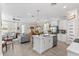 Open concept kitchen with center island, stainless steel appliances, modern lighting, and easy access to living area at 785 52Nd N Ave, St Petersburg, FL 33703