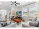 Sunlit living room with contemporary decor, features a wooden coffee table, and comfortable sofas at 785 52Nd N Ave, St Petersburg, FL 33703