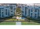 Beautiful waterfront condos featuring a community pool, lush landscaping, and breathtaking bay views at 7922 Sailboat Key S Blvd # 105, South Pasadena, FL 33707
