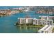 Aerial view of waterfront condos with water and city views at 7922 Sailboat Key S Blvd # 105, South Pasadena, FL 33707