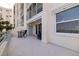 A wide balcony space has stylish outdoor furniture and ample space for entertaining or relaxing at 7922 Sailboat Key S Blvd # 105, South Pasadena, FL 33707