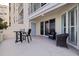 A spacious balcony with outdoor seating offers a serene retreat with picturesque surroundings at 7922 Sailboat Key S Blvd # 105, South Pasadena, FL 33707