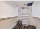 Walk-in closet with adjustable shelving, clothing bars, and a dedicated storage space for a tidy arrangement at 7922 Sailboat Key S Blvd # 105, South Pasadena, FL 33707