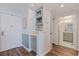 Hallway featuring a wet bar with storage, recessed lighting, and entryways to other areas of the home at 7922 Sailboat Key S Blvd # 105, South Pasadena, FL 33707