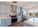 Modern kitchen featuring stainless steel appliances, custom cabinetry, and bright natural lighting at 7922 Sailboat Key S Blvd # 105, South Pasadena, FL 33707
