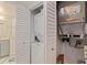 A laundry closet with a stacked washer and dryer in a white-doored closet at 7922 Sailboat Key S Blvd # 105, South Pasadena, FL 33707
