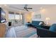 Comfortable living room featuring a modern ceiling fan and view of the water at 7922 Sailboat Key S Blvd # 105, South Pasadena, FL 33707
