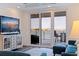 Relaxing living room featuring sliding glass doors to balcony with waterfront views at 7922 Sailboat Key S Blvd # 105, South Pasadena, FL 33707